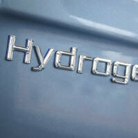embossed letters on the side of a vehicle spelling out "hydrogen"