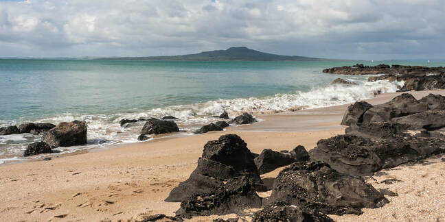 Milford beach with Rangitoto Island in background
