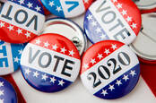 Badges from the 2020 US elections with 'vote' written on them