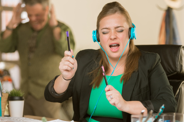 Woman singing loudly at work