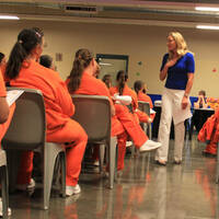 Olympic gold medalist Misty Hyman speaks to Perryville State Prison, Arizona, inmates about making a fresh start in life after their release from prison