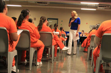 Olympic gold medalist Misty Hyman speaks to Perryville State Prison, Arizona, inmates about making a fresh start in life after their release from prison