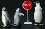 Penguins at stop sign