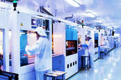 People using equipment Inside a silicon chip factory