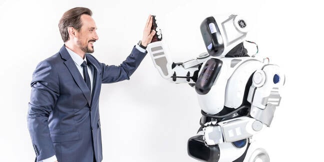 man high-fives robot