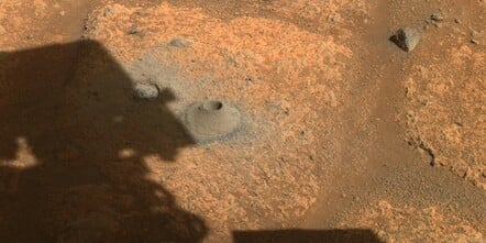 This image taken by one the hazard cameras aboard NASA’s Perseverance rover on Aug. 6, 2021, shows the hole drilled in what the rover’s science team calls a “paver rock” in preparation for the mission’s first attempt to collect a sample from Mars. Credits: NASA/JPL-Caltech