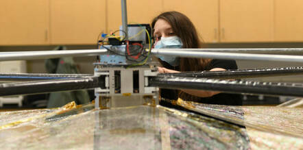 Purdue PhD candidate Arly Black tests sail deployment for Spinnaker3. Credit: Purdue University/David Spencer