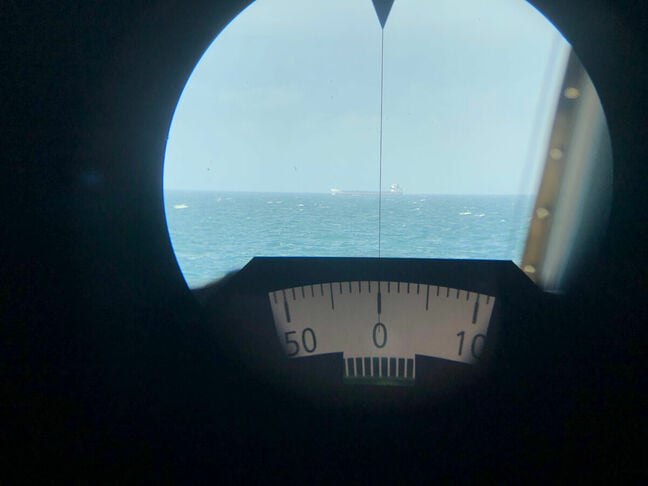 The view down HMS Severn's pelorus-mounted gyrocompass