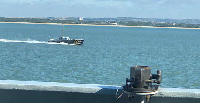 An RAF-liveried motor launch passes HMS Severn on the Solent in September 2021