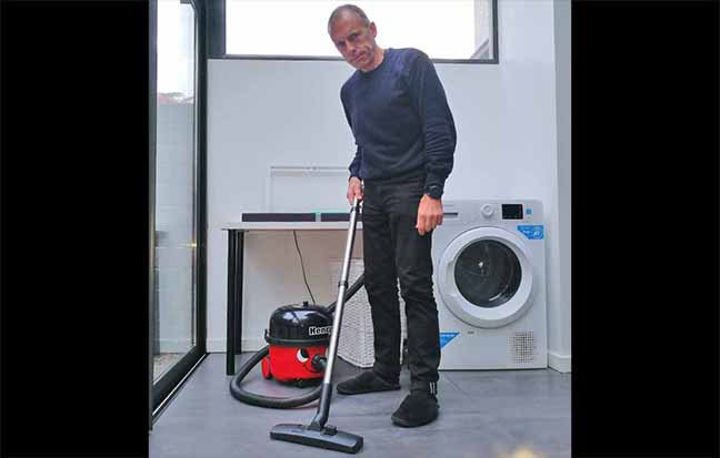 Photo of Dabbsy using a Henry vacuum cleaner.