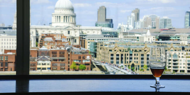 London skyline, beer on windowsill