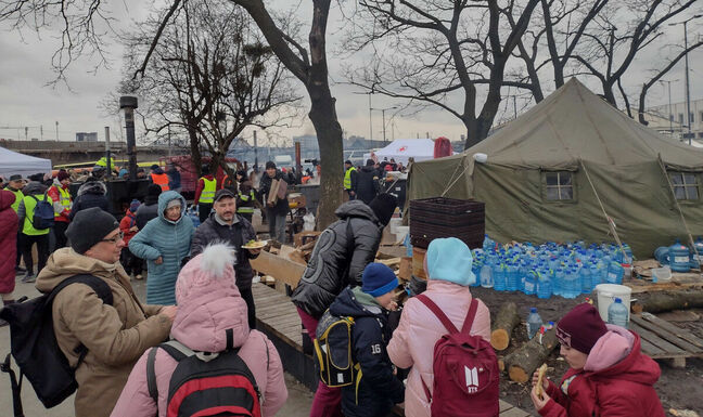 Refugees queue for humanitarian aid in Lviv. Pic: Vic Harkness