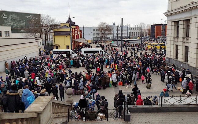 Refugees queue at Lviv railway station, Ukraine. Pic: Vic Harkness