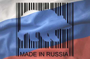 A barcode with the outline of a bear cut out of it over a Russian flag with the words: Made in Russia