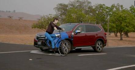 A semi-autonomous car hits a test dummy on a bicycle