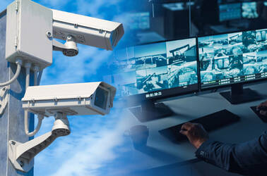 Someone monitoring CCTV cameras