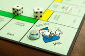 Close up of the go to jail square on a Monopoly board
