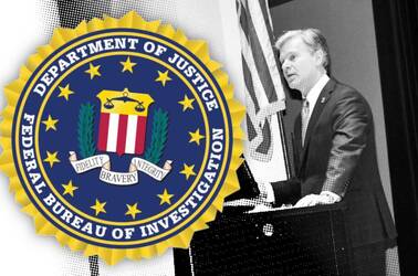 FBI director Christopher Wray giving a speech with the FBI seal in view