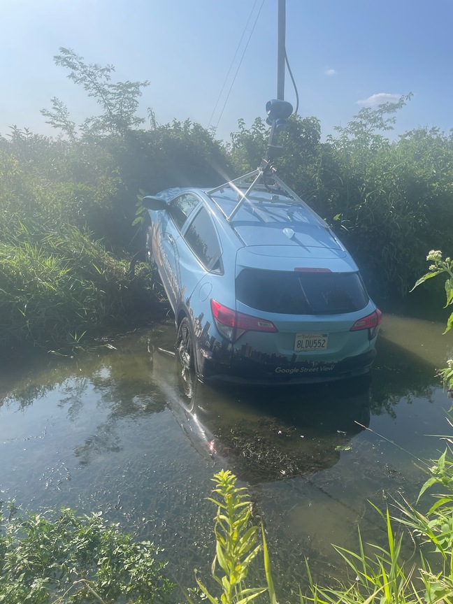 Google Street View car stuck in creek after police chase