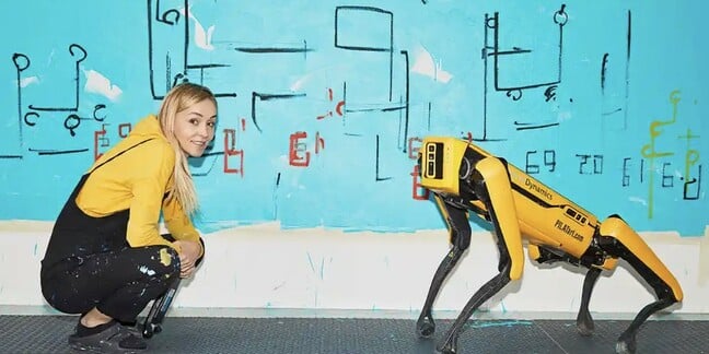 Artist Agnieszka Pilat with Boston Dynamics robodog Spot and one of its painting 