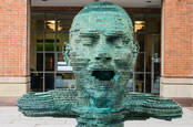 Belfast, northern Ireland - A bronze statue named `Eco' standing outside the McClay Library