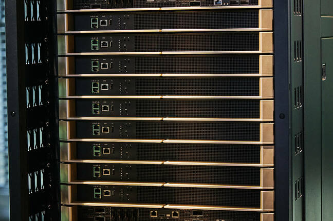 In between the NVL72's compute nodes are a stack of nine NVLink switches, which provide 1.8 TBps of bidirectional bandwidth each of the systems 72 GPUs.