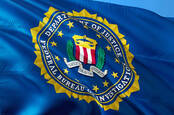 FBI logo on a billowing flag