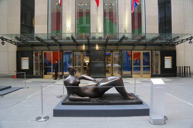 A reclining Henry Moore sculpture in the atrium of Christie's main headquarters at Rockefeller Plaza in New York. 