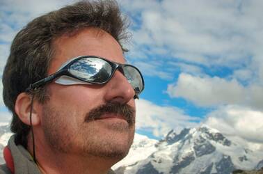 Jon Kern, co-author of Agile Manifesto, wearing sunglasses with mountain in the background