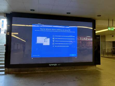 Windows welcome screen on advertising screen in Warsaw Station