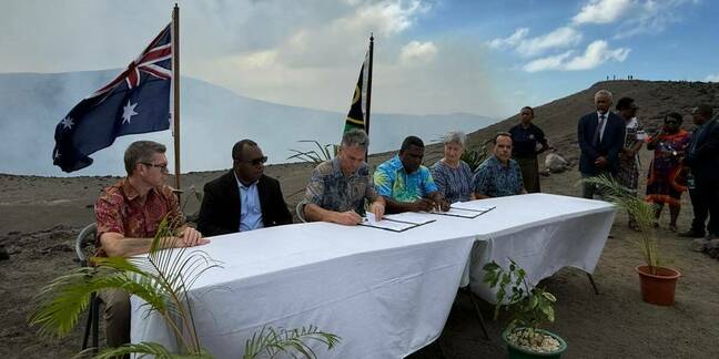 Vanuatu and Australian officials sign the Nakamal Agreement on the rim of active volcano Mount Yasur