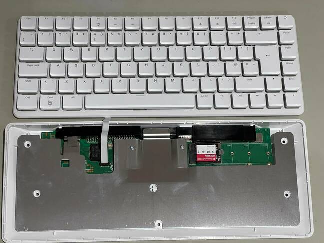 Five ordinary screws are all that stand between a user and the machine's internals. (click to enlarge) – Pic: Richard Speed