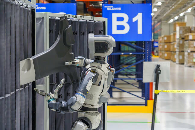 An Atlas prototype conducting part sequencing work at a Hyundai factory as part of earlier proof of concept work atlas-prototype-honda-POC