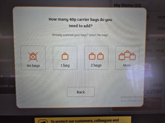 Sainsbury's self-service screen with Windows Activation message